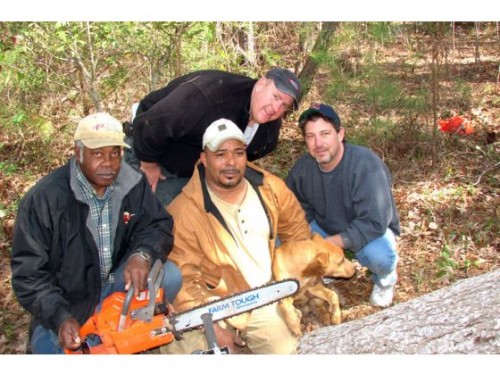 Harlowe Volunteer Fire Department pose with rescued dog